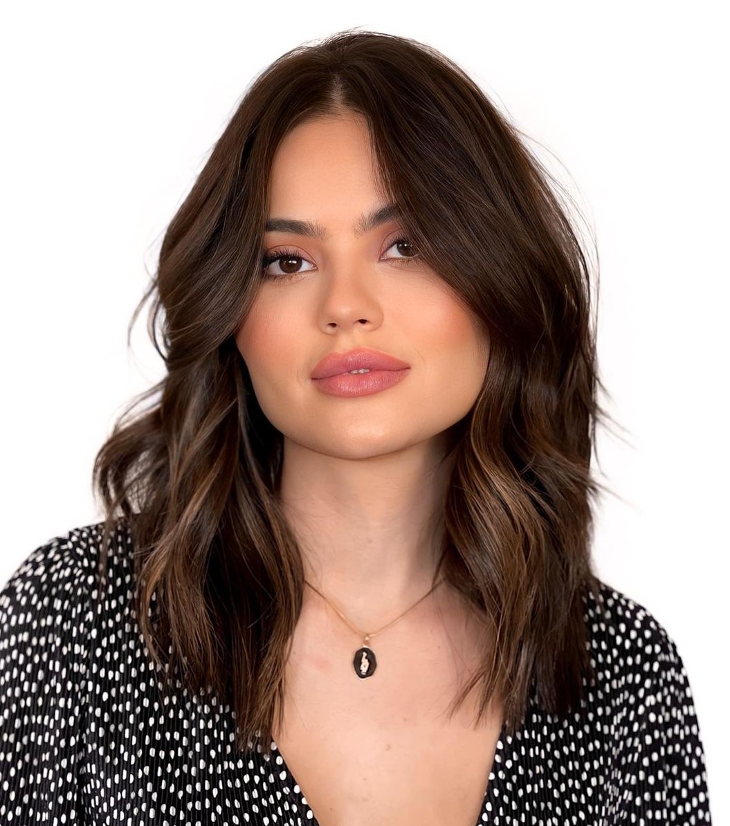 Feminine Mid-Length Brunette Hairstyle